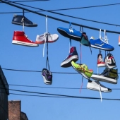 6 theories explaining the strange custom of hanging shoes on wires