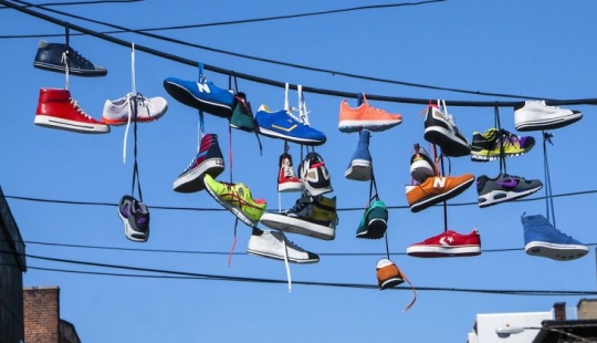 6 theories explaining the strange custom of hanging shoes on wires