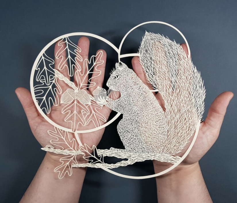 A girl cuts out intricate masterpieces from paper