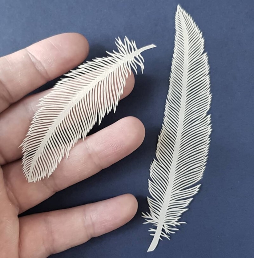 A girl cuts out intricate masterpieces from paper