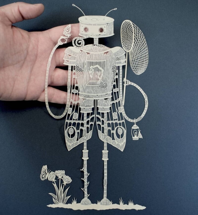 A girl cuts out intricate masterpieces from paper