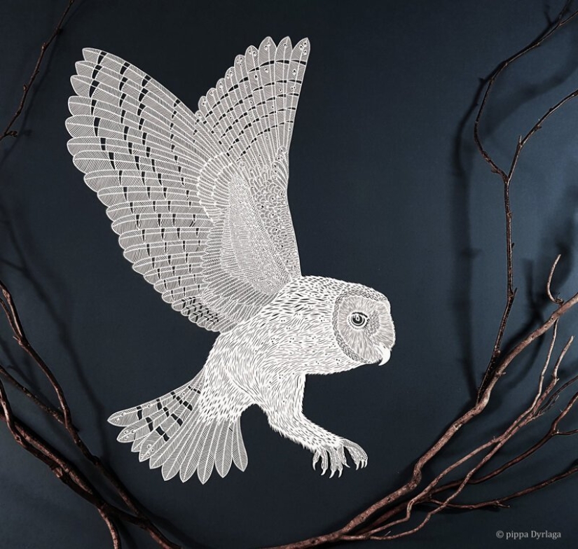 A girl cuts out intricate masterpieces from paper