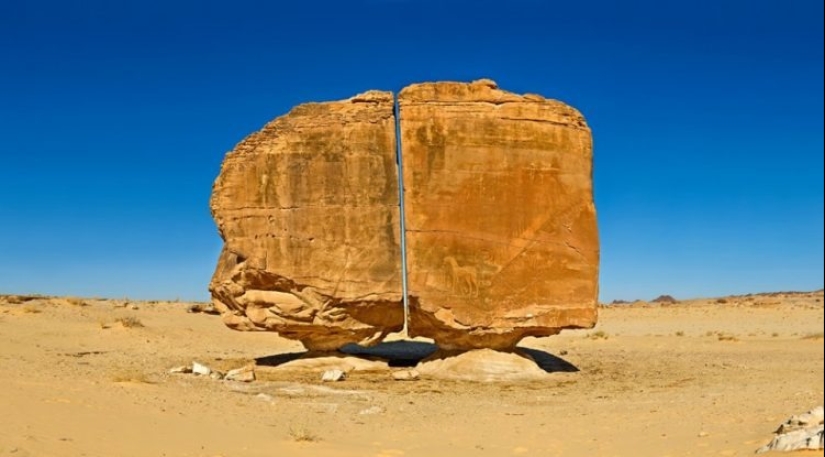 Al-Naslaa is a mystical rock with a perfect fault in the middle of the Arabian desert