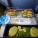 How different is the food of passengers in business class and economy class on the plane