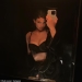 Kylie Jenner stuns in tiny strapless dress and knee-high boots for Paris Fashion Week... after sharing sizzling snap in black bra and matching underwear