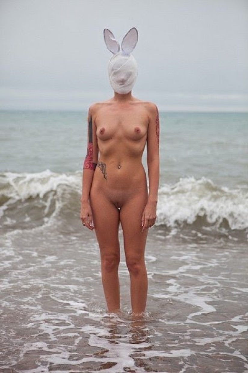 Naked girls in masks by Ben Hopper