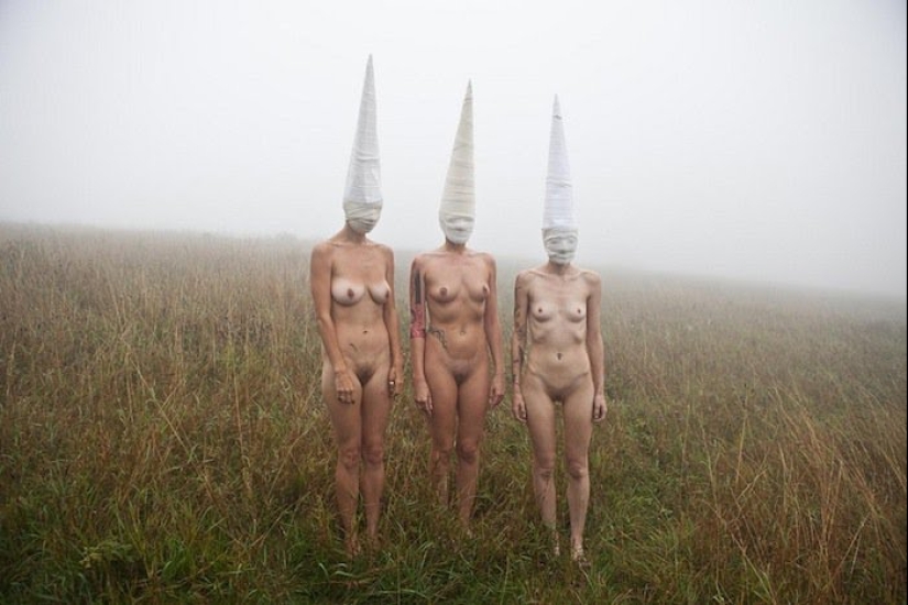 Naked girls in masks by Ben Hopper