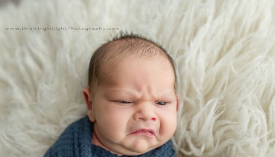 Newborn Grumpy Baby Breaks The Internet With Squishy Cheeks, Zero Smiles, And All Sass