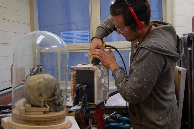 Step-by-step process of carving a skull from old books