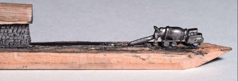 The artist cuts out tiny masterpieces from pencil slates