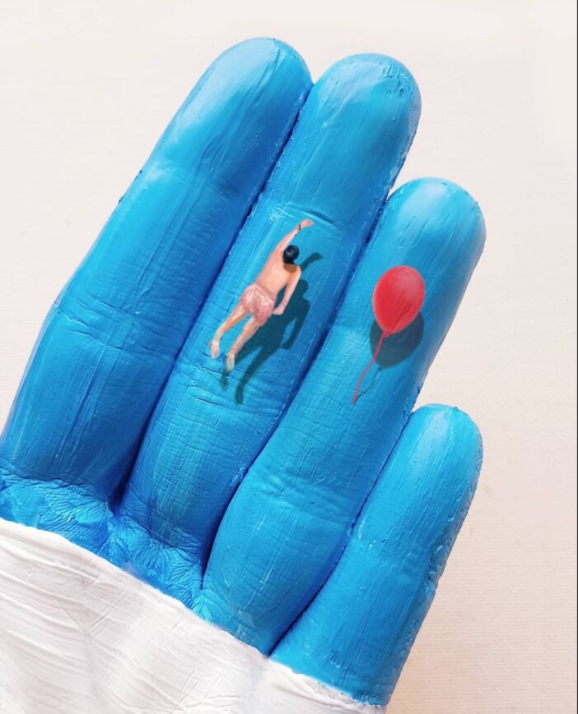 The artist uses her hands as a canvas to show hidden worlds