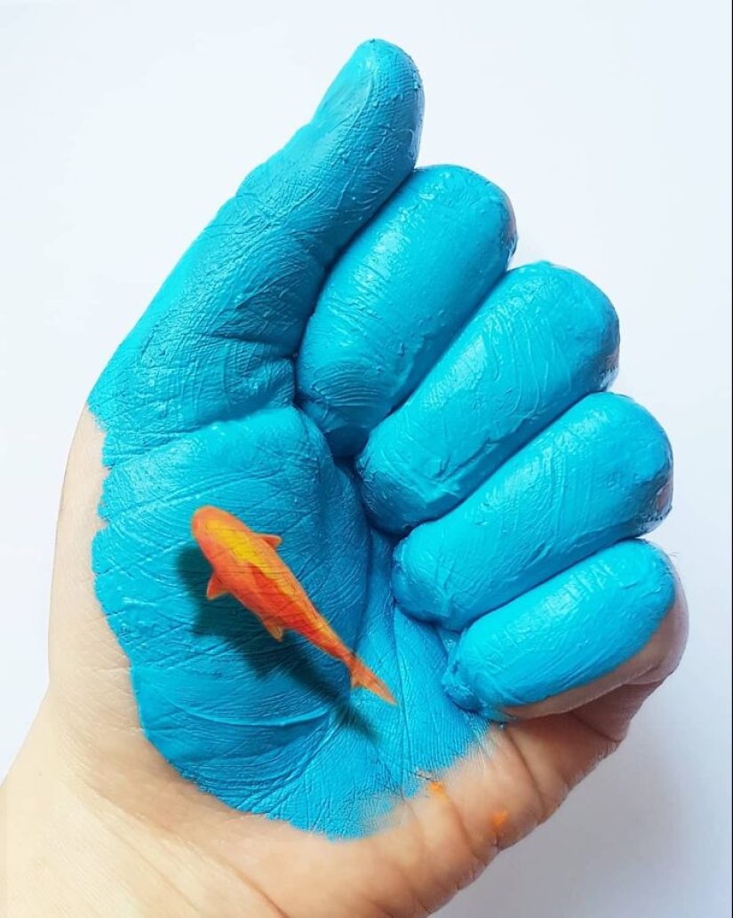 The artist uses her hands as a canvas to show hidden worlds