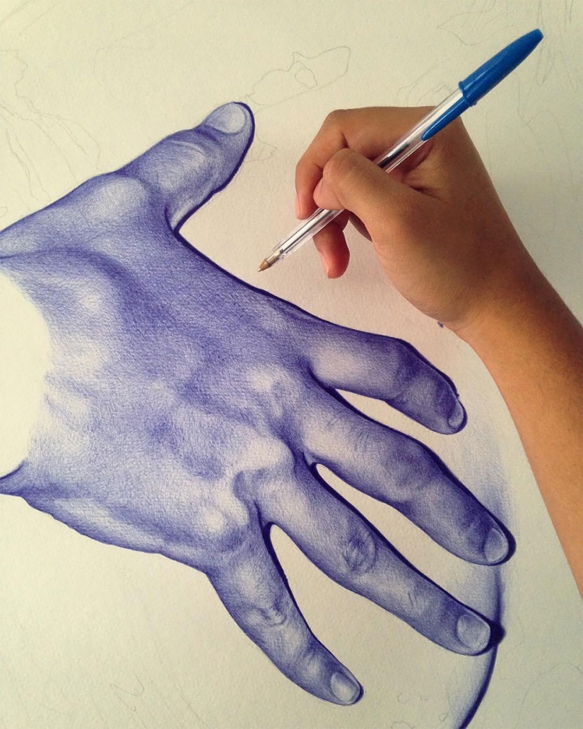 The superiority of blue: a young man writes fascinating pictures with a ballpoint pen