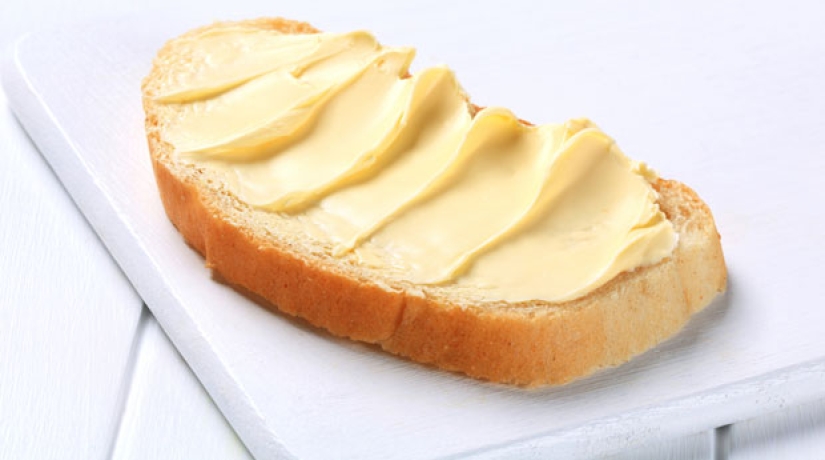 What is a spread and how does it differ from butter and margarine