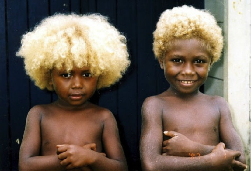 Where did dark-skinned people with light hair come from in Melanesia