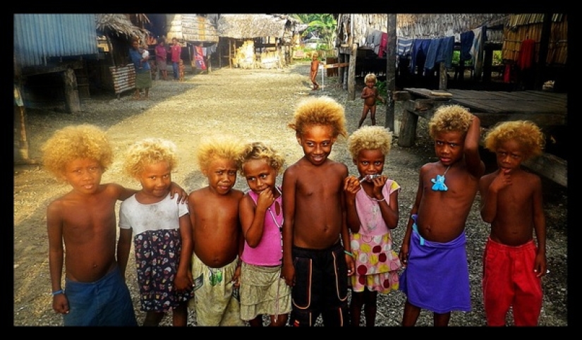 Where did dark-skinned people with light hair come from in Melanesia