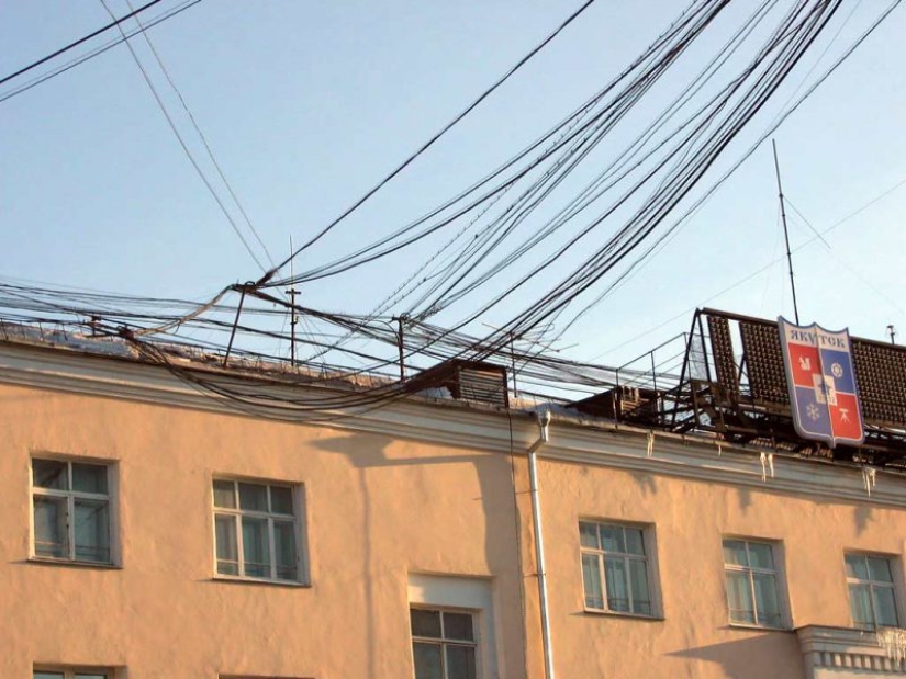 Who and why stretches wires between houses