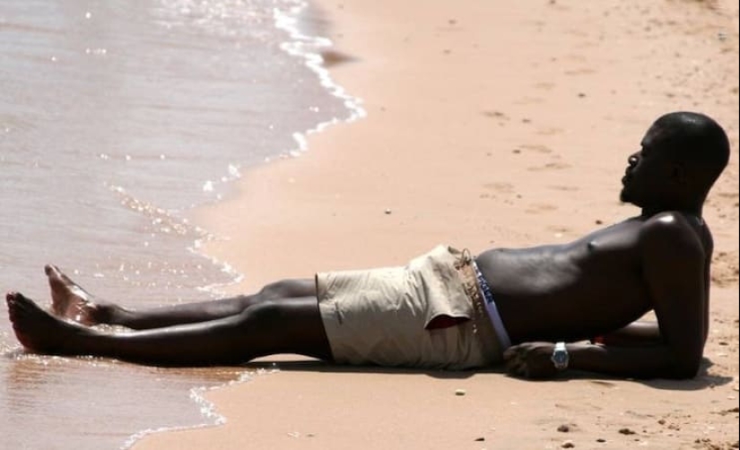 Why do Africans have dark skin if black attracts heat