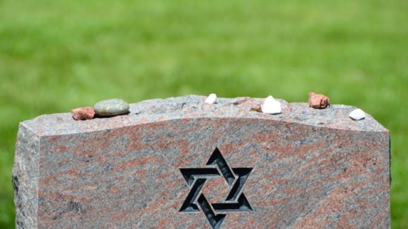 Why do Jews bring stones to the cemetery, not flowers