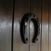 Why do they hang a horseshoe over the door for good luck