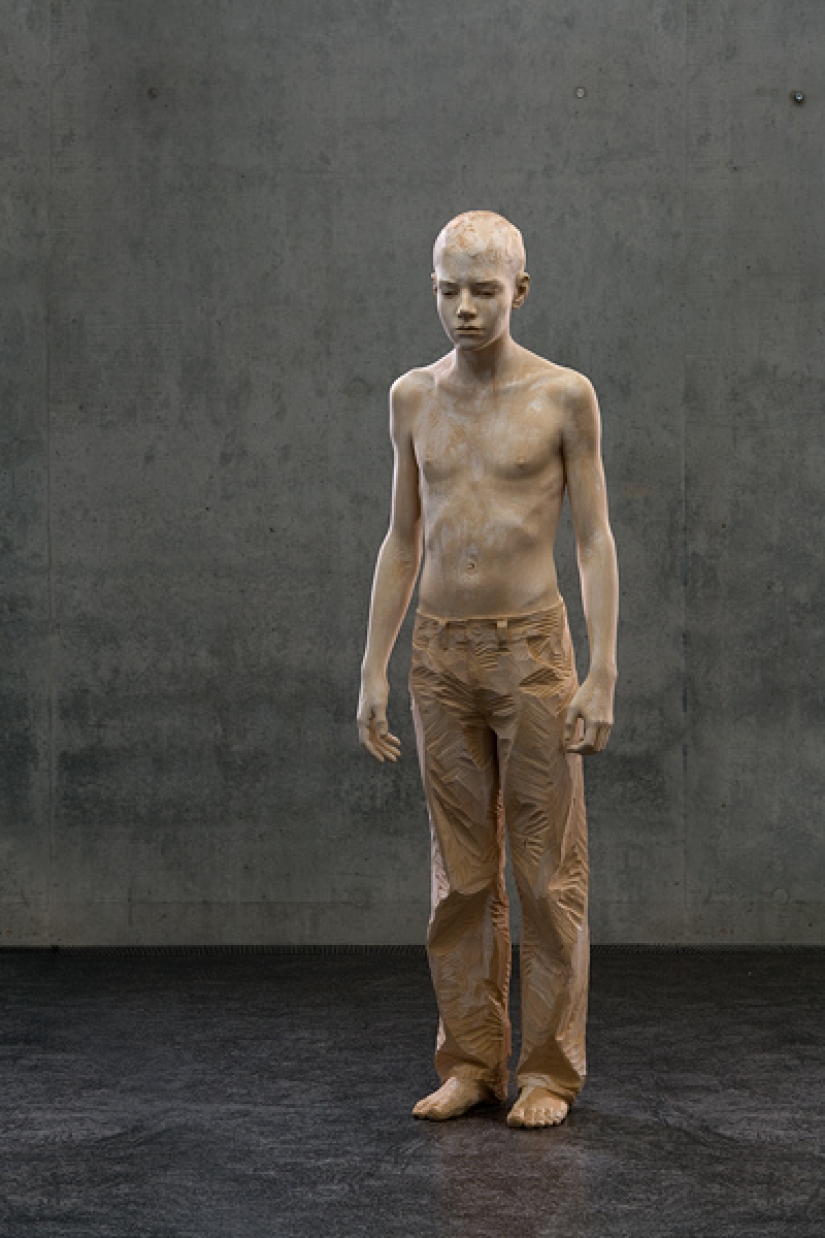 Youth captured in hyper-realistic wood sculptures