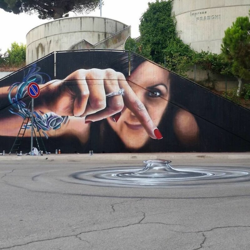 Callejero interactivo de arte: el artista entra en 3D pinturas en la calle