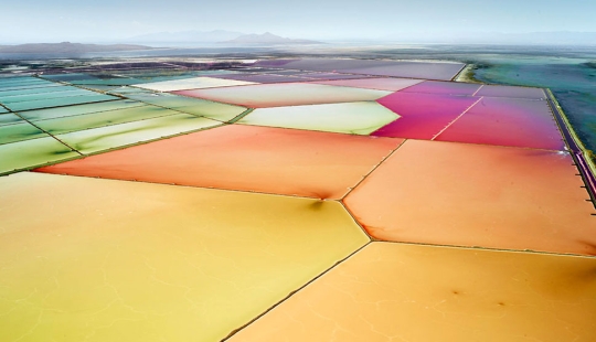 Images of saltworks from a height, blurring the boundaries between photography and painting Images of saltworks from a height, blurring the boundaries between photography and painting