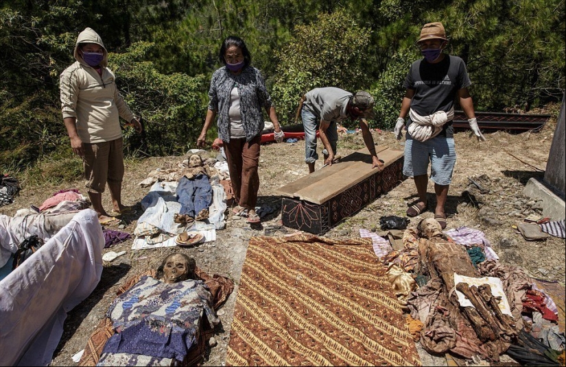 Manene Festival, during which the Toraja people dig up the bodies of their deceased relatives