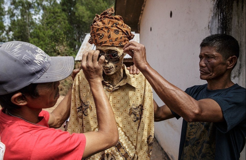 Manene Festival, during which the Toraja people dig up the bodies of their deceased relatives