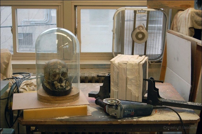 Step-by-step process of carving a skull from old books Step-by-step process of carving a skull from old books