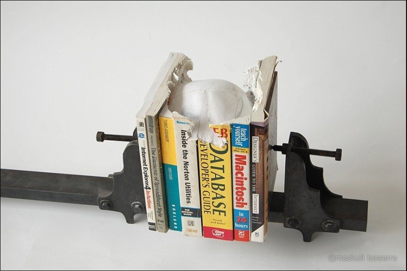 Step-by-step process of carving a skull from old books Step-by-step process of carving a skull from old books