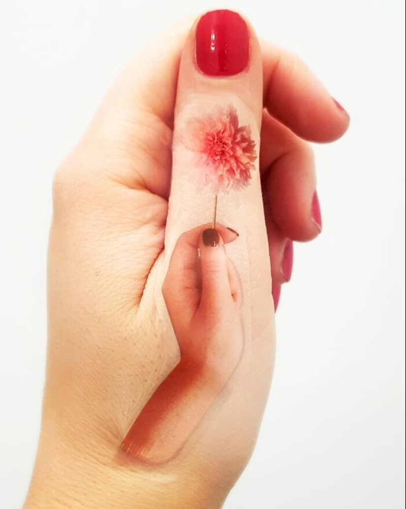 The artist uses her hands as a canvas to show hidden worlds The artist uses her hands as a canvas to show hidden worlds