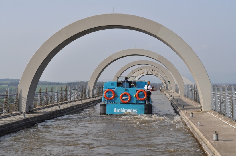 The Falkirk Wheel is a unique rotating structure that lifts entire ships