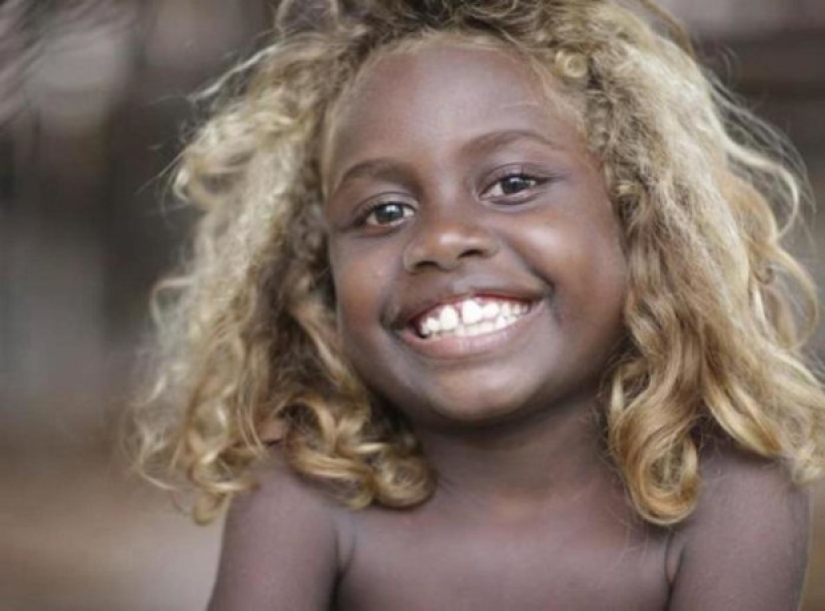 Where did dark-skinned people with light hair come from in Melanesia