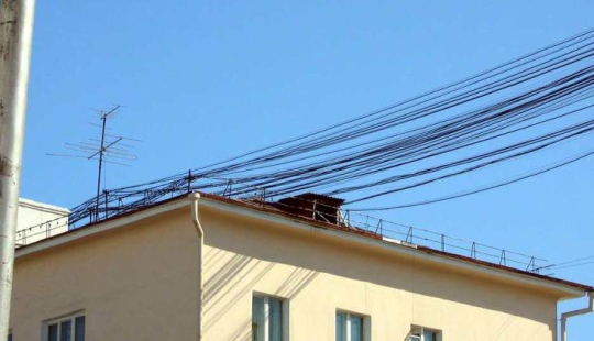 Who and why stretches wires between houses