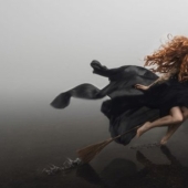 Why were witches depicted riding a broom?